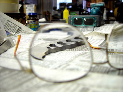 Milled and carved blade steel through safety glasses