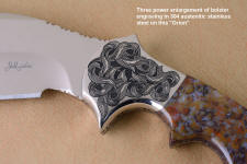 "Orion" three power enlargement of bolster engraving  in 440C high chromium stainless steel blade, hand-engraved 304 stainless steel bolsters, Rio Grande Agate gemstone  handle, hand-carved leather sheath inlaid with frog skin