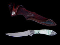 "Little Tusas" obverse side view in 440C high chromium stainless steel blade, hand-engraved low carbon steel bolsters, Biotite gemstone handle, green rayskin inlaid in hand-carved leather sheath