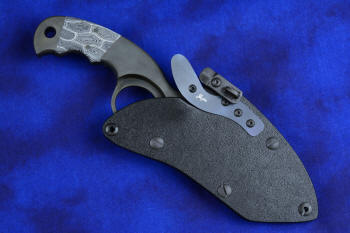 "Skeg"  tactical, counterterrorism, crossover knife, sheathed view in T4 Cryogenically treated ATS-34 high molybdenum martensitic stainless steel blade, 304 stainless steel bolsters, white and black tortoiseshell pattern G10 fiberglass/epoxy composite handle, hybrid tension tab-locking sheath in kydex, anodized aluminum, black oxide stainless steel and anodized titanium