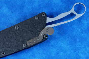 Locking Tab Wedge shown with wedge under titanium dogleg spring, lifting it away from knife, unlocking it from sheath