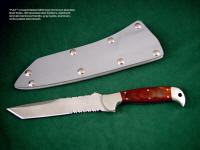 "PJLT" obverse side view in bead blasted 440C high chromium stainless steel blade, 304 stainless steel bolsters, Stabilized Laminate Phenolic (Dymondwood) handle, gray kydex, aluminum, stainless steel sheath