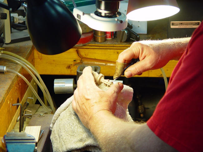 Hand-engraving a cast bronze sword pommel